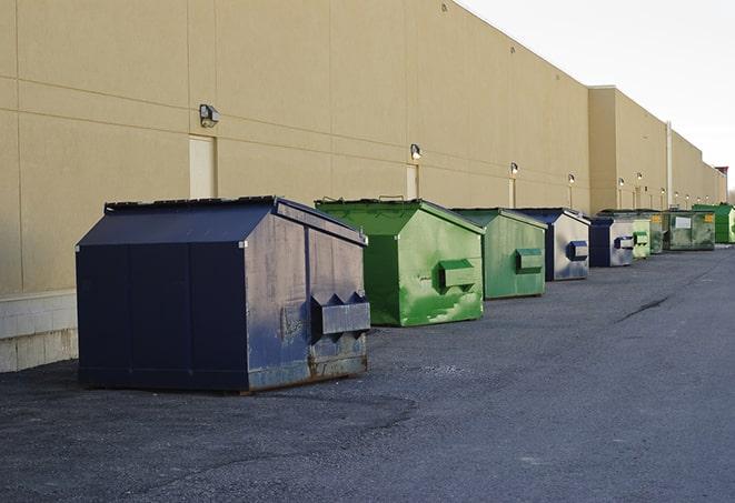 large construction waste containers in a row at a job site in Bethel